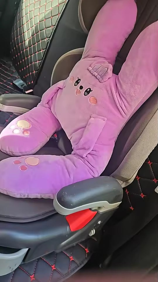 Customer photo of a pink RideNuzzle travel pillow on a vehicle seat.