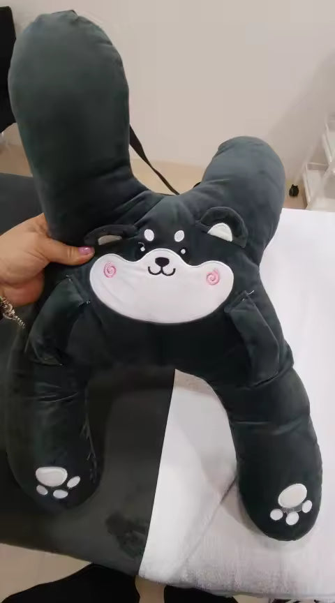 Customer photo of a dark gray RideNuzzle travel pillow being held and shown.