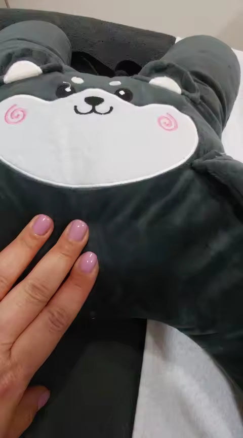 Customer close-up photo of a dark gray RideNuzzle travel pillow.