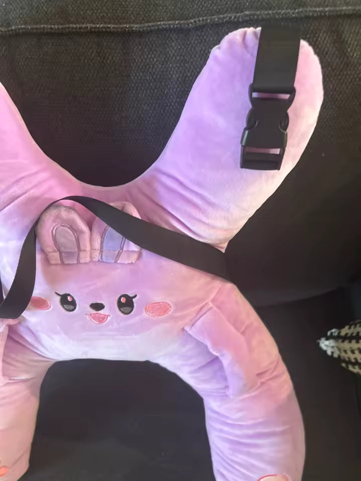 Customer photo of a pink RideNuzzle travel pillow fitted on a car seat.