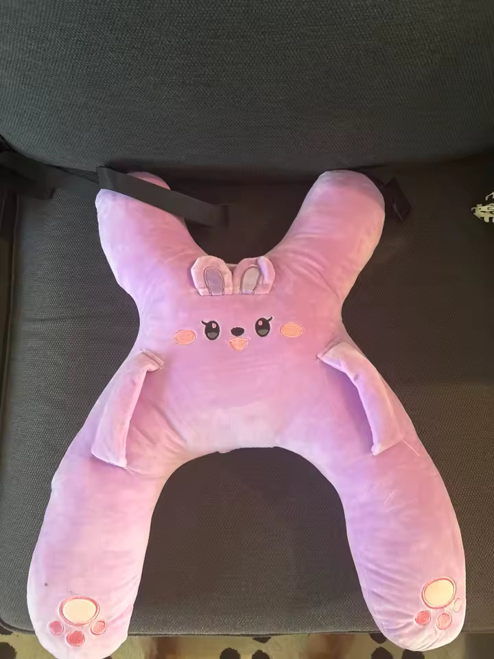 Customer photo of a pink RideNuzzle travel pillow.